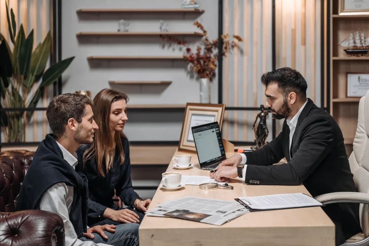 Financial advisor reviewing account details with clients