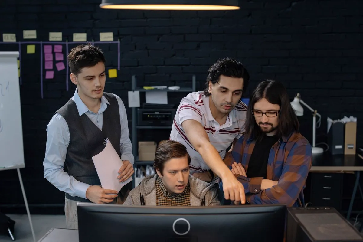 Product team reviewing software on screen together