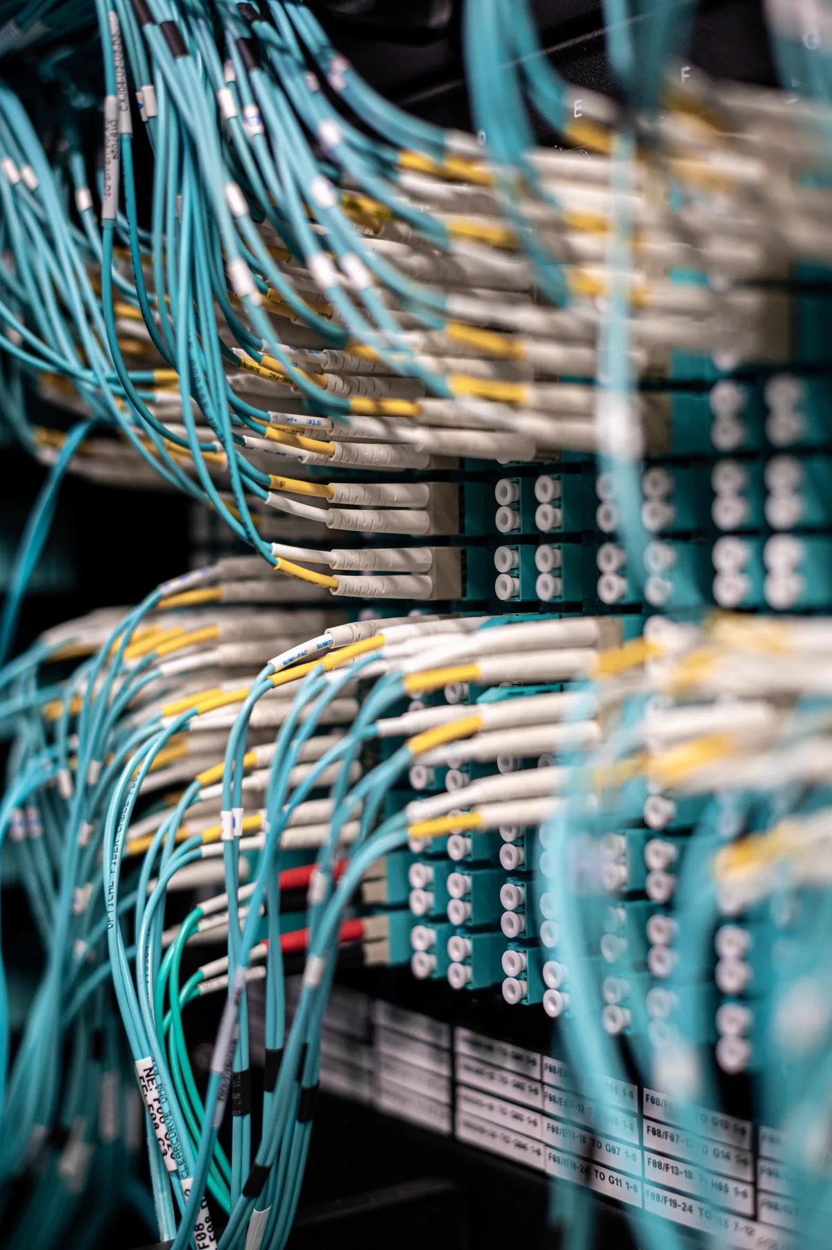Fiber optic network patch panel with connected cables