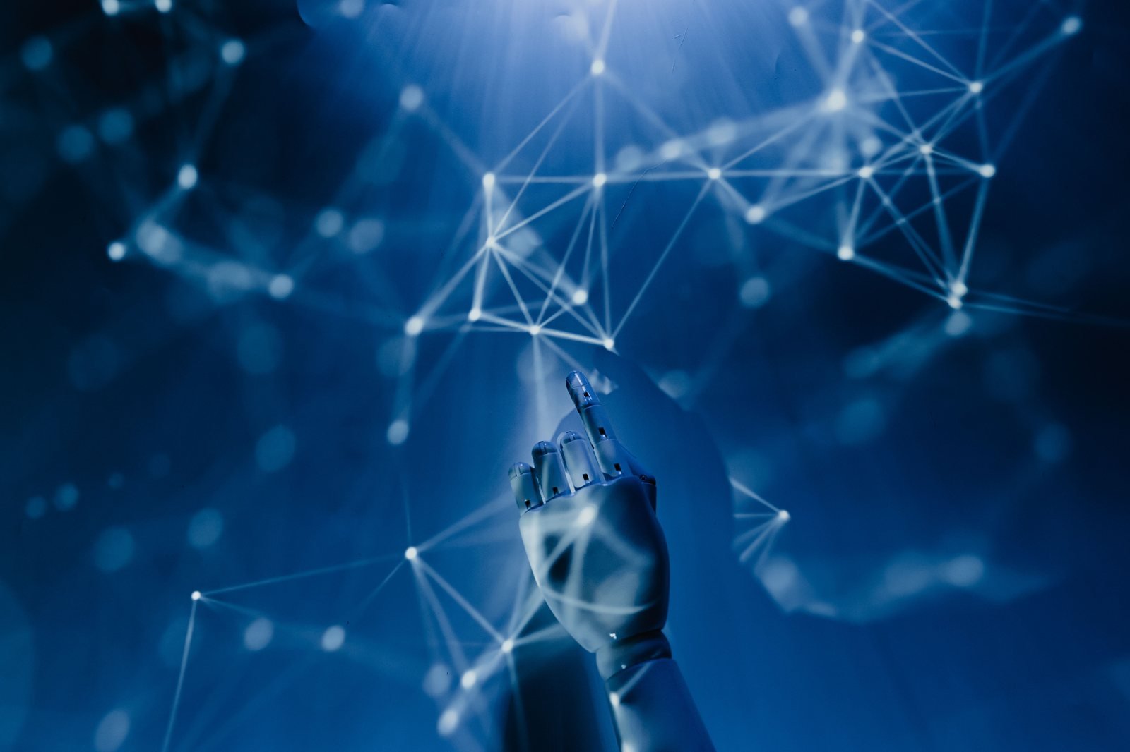 Robotic hand reaching toward a glowing neural network, representing AI-driven forecasting