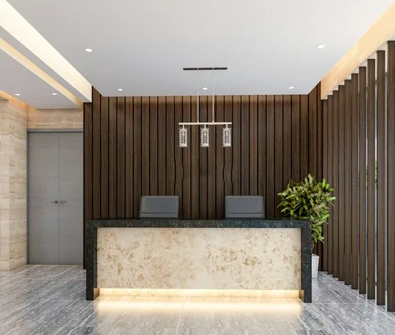Modern office lobby with reception desk and elevators