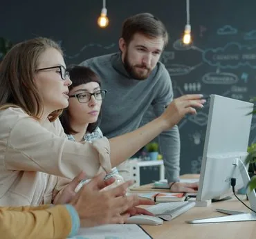 Team reviewing a digital product design together on screen